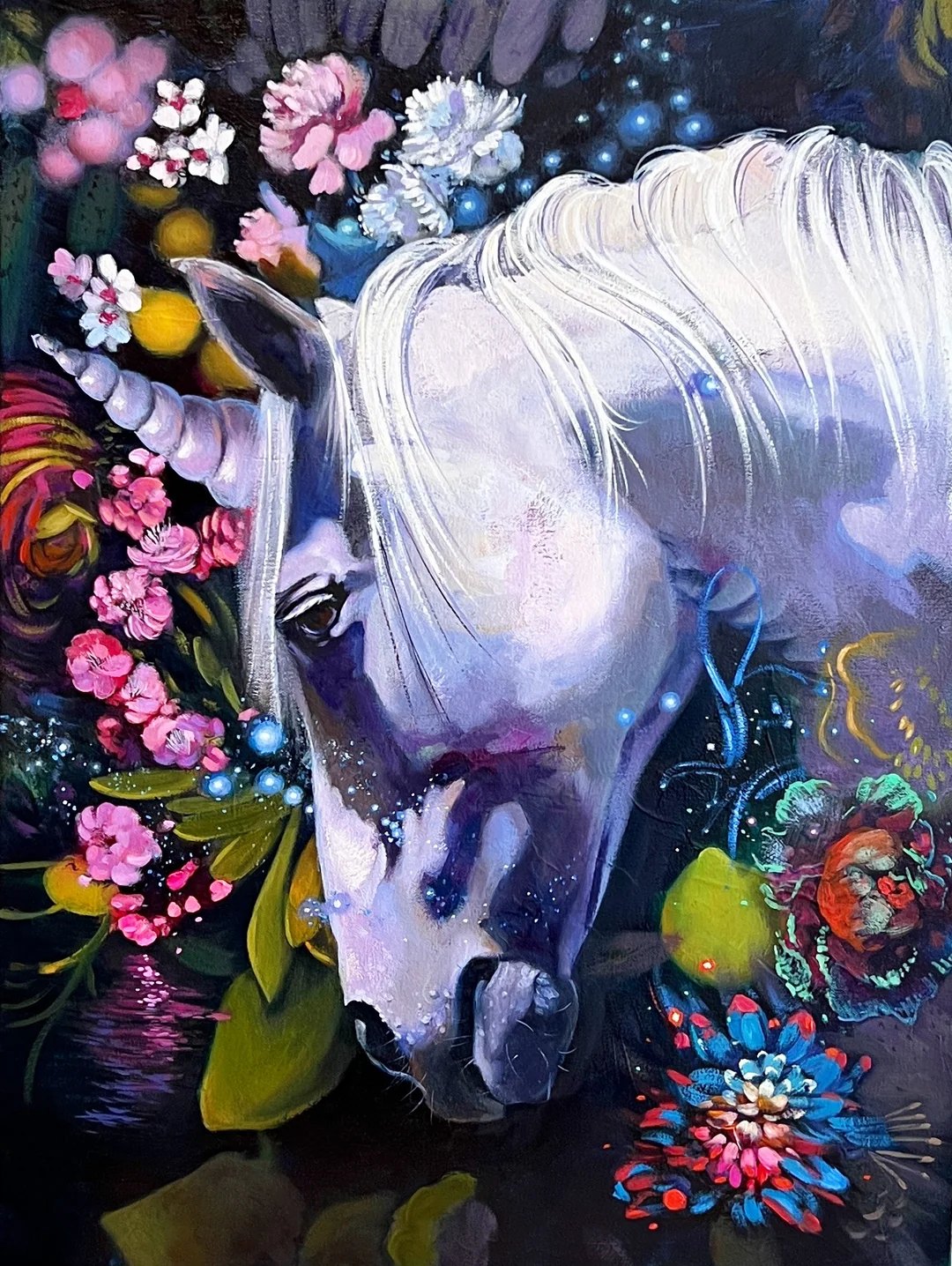 Abstract realism painting of a white unicorn bowing its head among pink blossoms