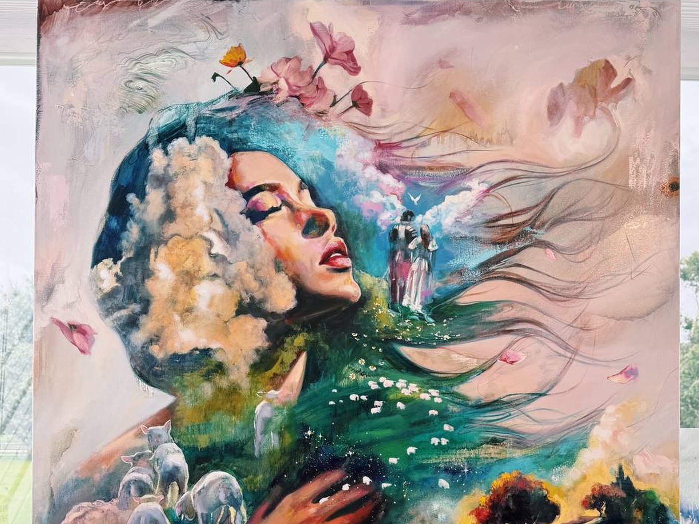 Detail of an oil painting by Dimitra Milan: a woman in profile with clouds for hair, blossoms above her and a green pasture of grazing sheep across her shoulder